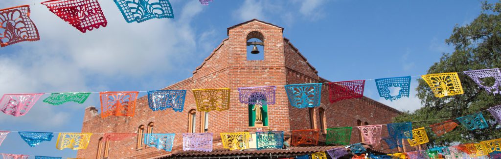 Papel Picado banners hanging throughout Historic Market Square in San Antonio, san antonio performance tours