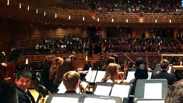 high school performance tours, a class watching a performance