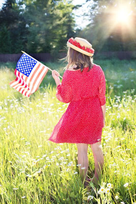 girl with patriotic flag, 4th of july