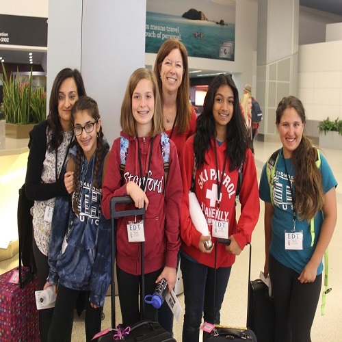 students checking in at the airport