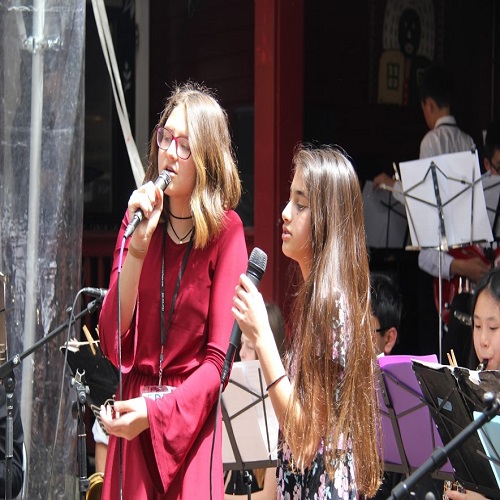students performing outdoors