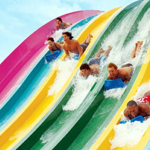 People going down steep waterslides at northern California waterpark